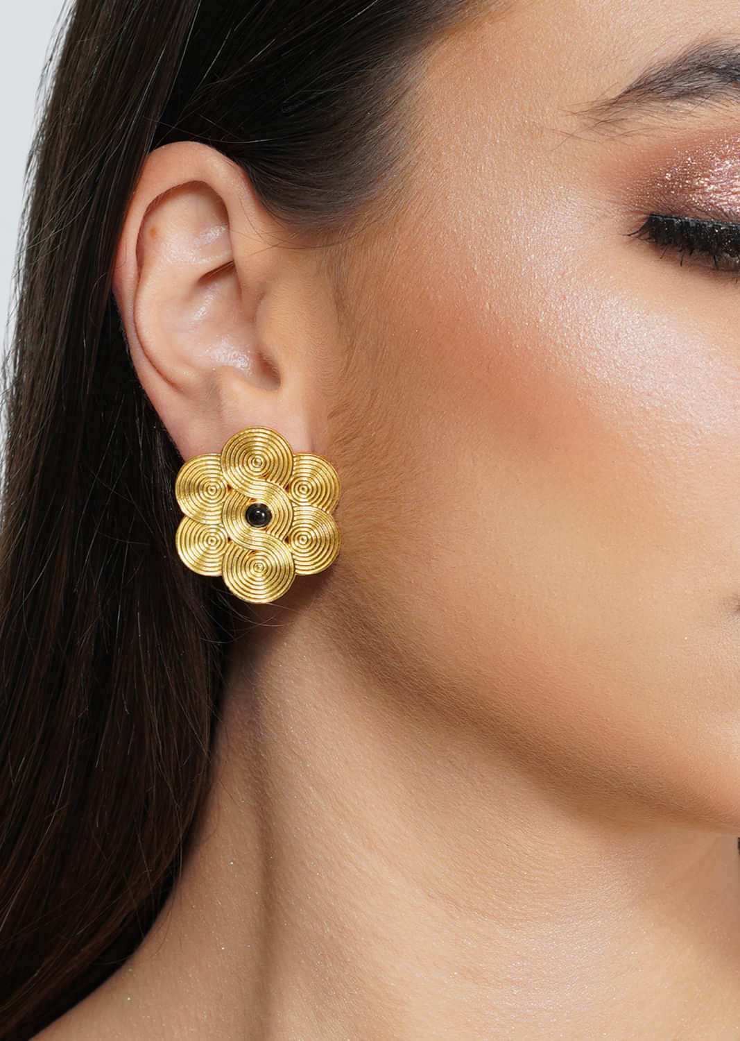 Gold Plated Stud Earrings In Floral Design Embellished With Black Onyx Stone In The Centre