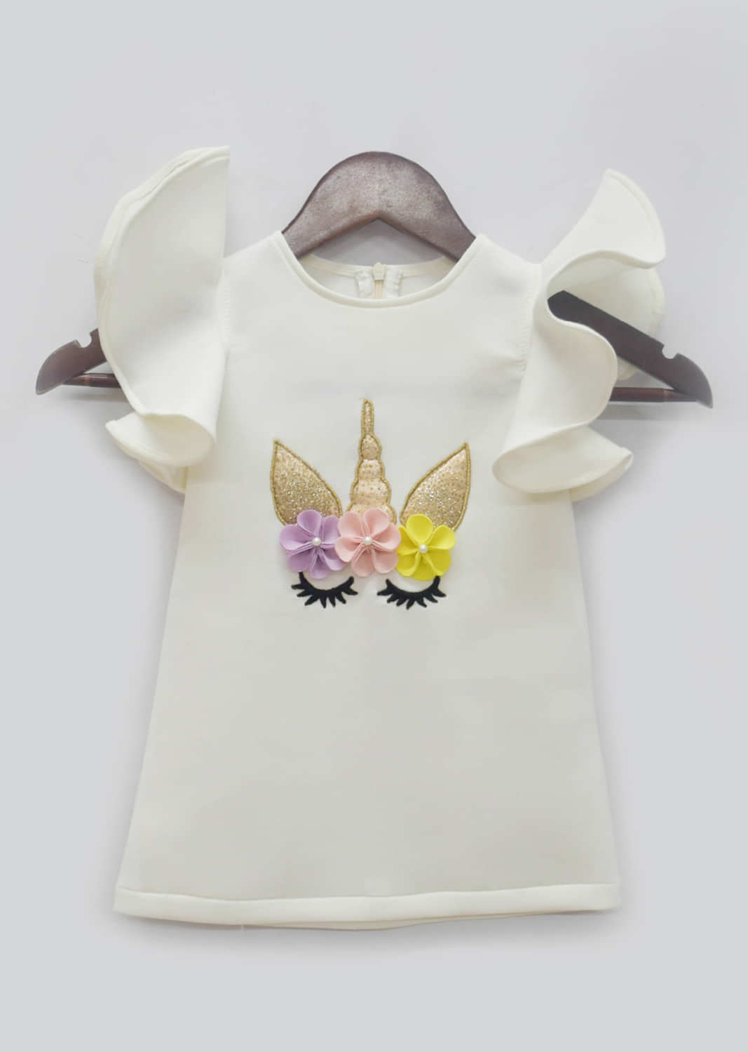 Kalki Girls Off white dress in neoprene with unicorn motif and frill sleeves by fayon kids
