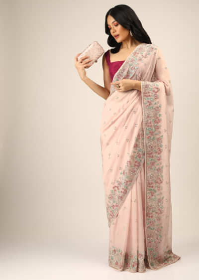 Baby Pink Saree In Organza With Multi Colored Sequins Embroidered Floral Motifs On The Border And Butti Work  