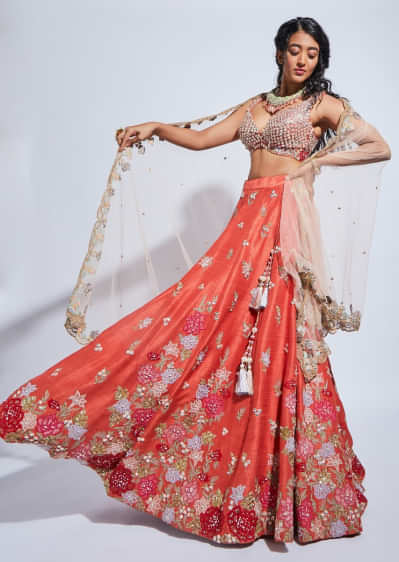 Coral Lehenga Choli With Resham Embroidered Summer Blossoms Along The Hemline And Scattered Buttis 