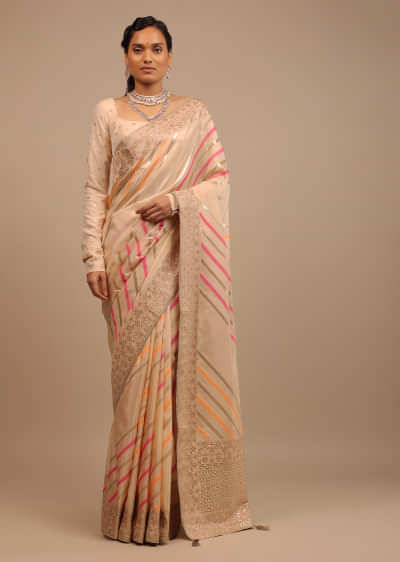 Cream Saree In Dola Silk With Multi Colored Woven Diagonal Stripes And Floral Border