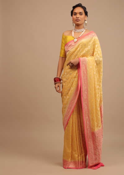 Canary Yellow Traditional Georgette Saree With Contrasting Peach Brocade Border And Jaal Work