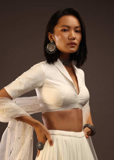 Egret White Half-Sleeved Blouse With Long Collar Neckline. Front Hook Closure With A Straight Hemline.
