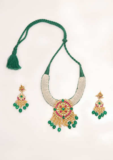 Emerald green thread necklace set with jadau pendant only on Kalki