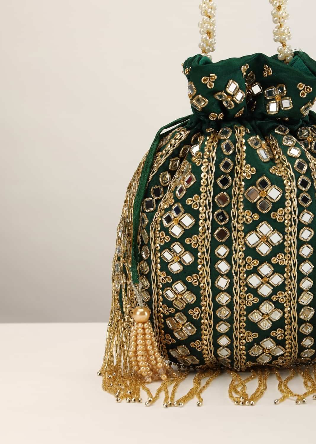 Emerald Green Potli In Satin With Hand Embroidery Detailing Using Mirror And Cut Dana Fringes