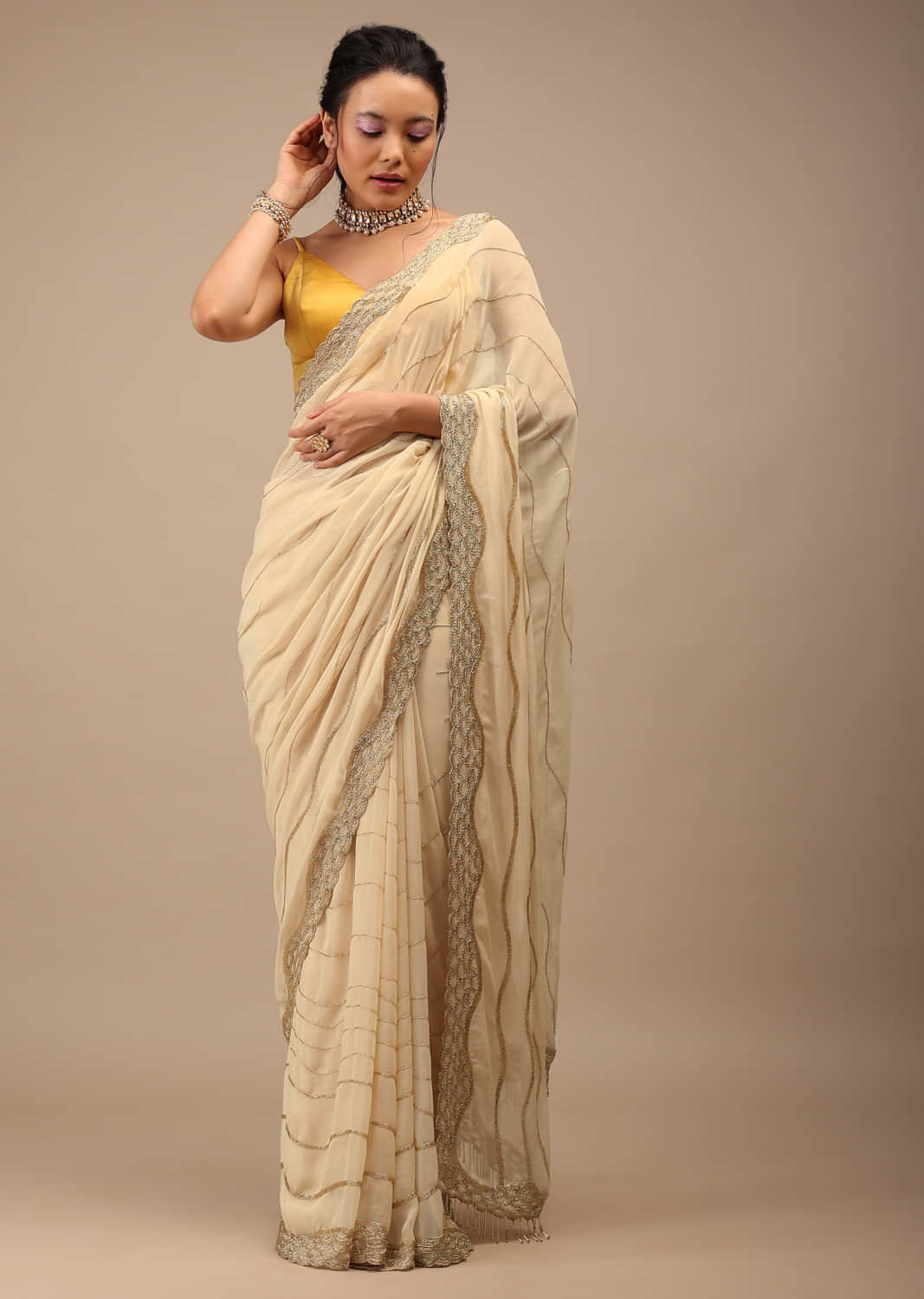 Frozen Dew Georgette Saree Infused With Golden Cut Dana And Copper Detailing 