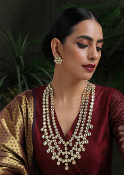 Gold Plated Multi Layered Necklace Encrusted With Kundan In A Flawless Pattern