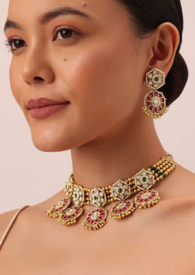 Gold Tone Temple Choker Set With Floral Motifs And Meenakari