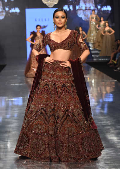 Chocolate Brown Archetypal Lehenga In Velvet Raw Silk With Heavy Embroidery And Trail - NOOR 2022