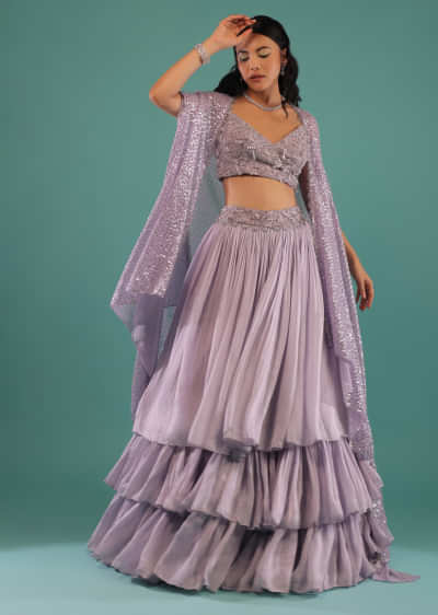 Lavender Layered Skirt With A Resham And 3D Beads Embroidered Crop Top And High Low Sequins Cape