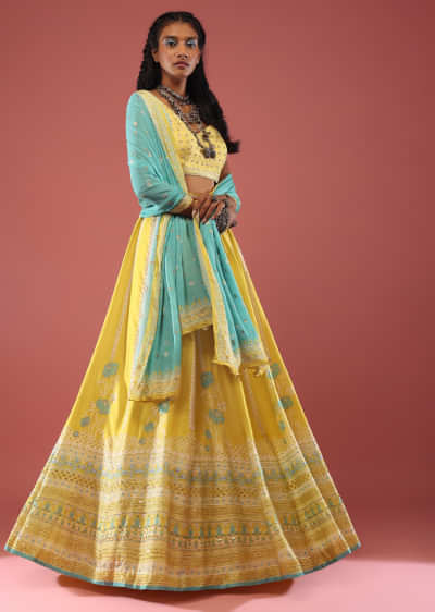 Lime Yellow Lehenga With Floral Print And A Well-Embroidered Silk Blouse Are Paired With A Blue Chiffon Dupatta