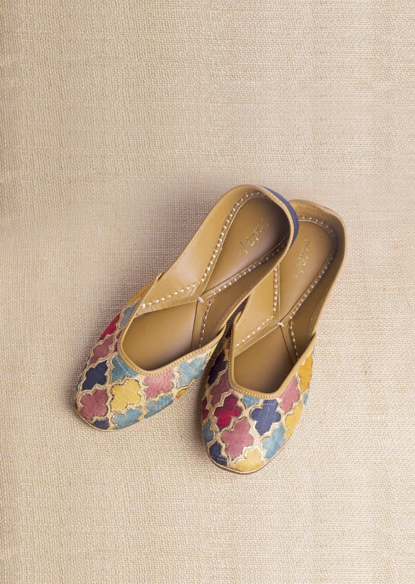 Multi Color Juttis In Raw Silk With Multi Colored Mughal Jaal And Pita Zari Highlights  By Vareli Bafna