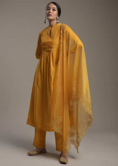 Mustard Yellow A Line Suit In Cotton With Pin Tucks Detailing And Teamed With A Zari Embroidered Organza Dupatta  