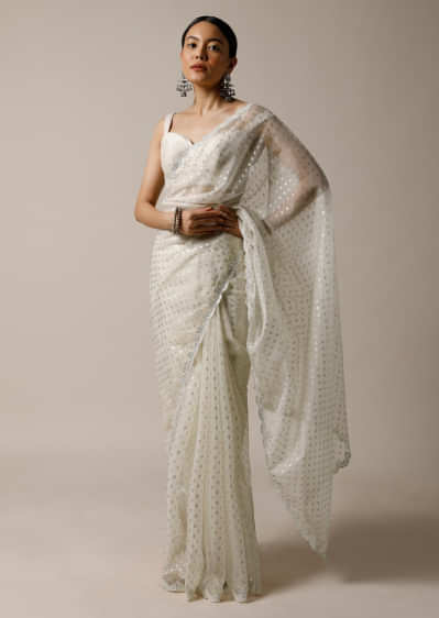Pearl White Saree In Organza With Foil Printed Buttis And Mirror Work On The Border Along With Unstitched Blouse