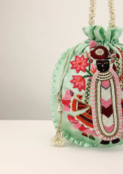 Pista Green Potli In Satin With Hand Embroidered Goddess Motif Using Multi Colored Thread, Moti And Stone