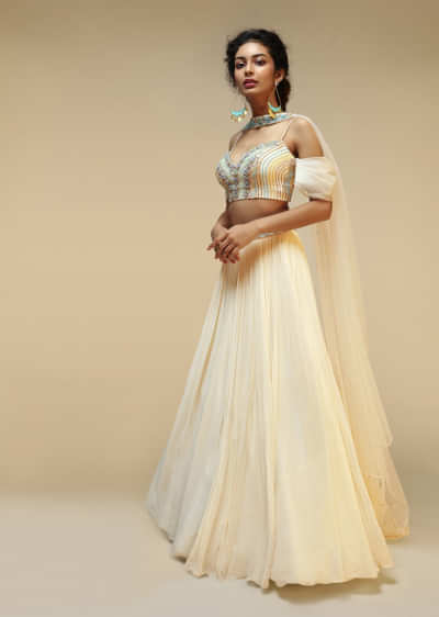 Powder White Lehenga Choli With Pleated Cold Shoulder Sleeves And Multi Colored Hand Embroidery Featuring 3D Flowers 