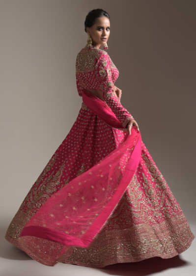 Rani Pink Lehenga Choli In Raw Silk With Heavy Embroidery Work In Heritage Floral Design And Butti Work 