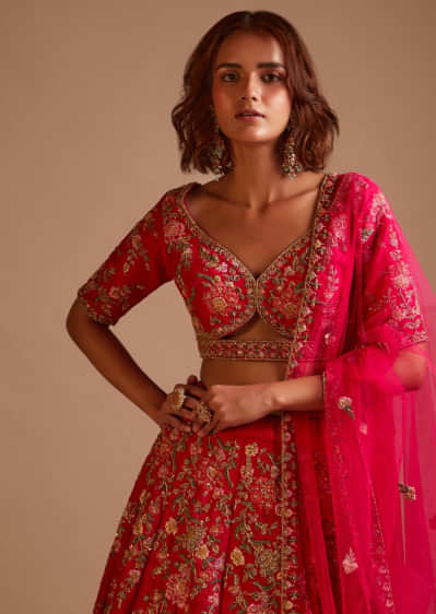 Rani Pink Lehenga Choli In Raw Silk With Hand Embroidered Cluster Of Flowers Cascading Into Floral Buttis 