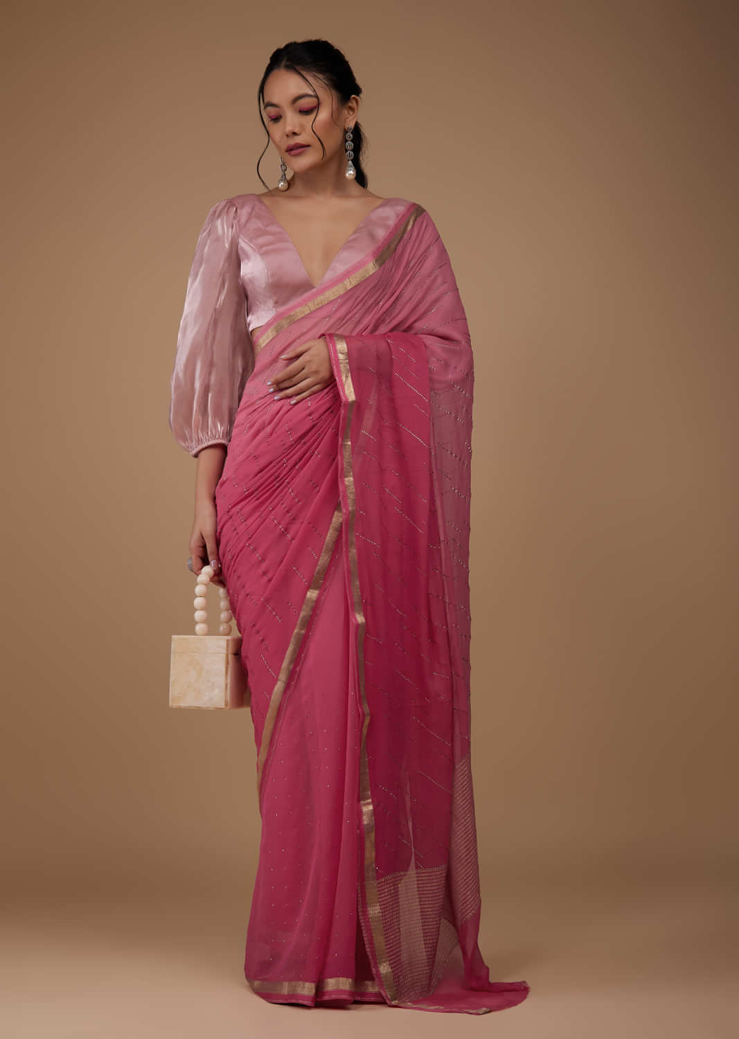 Rouge Pink Chiffon Saree With Swarovski Stone Embellishments And Zari Border