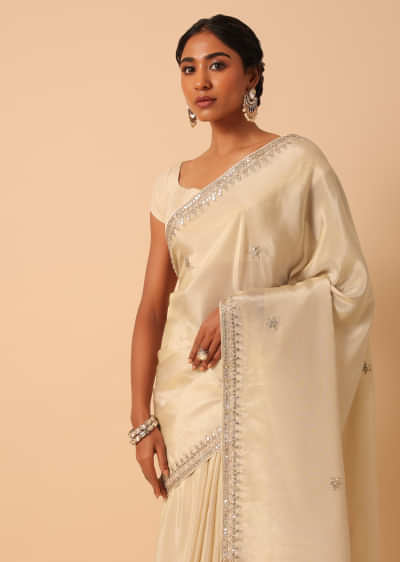 White Saree In Tissue Silk With Gota Patti Work And Unstitched Blouse Piece